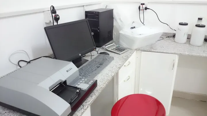 Laboratory analyser and computer at the quarantine lab