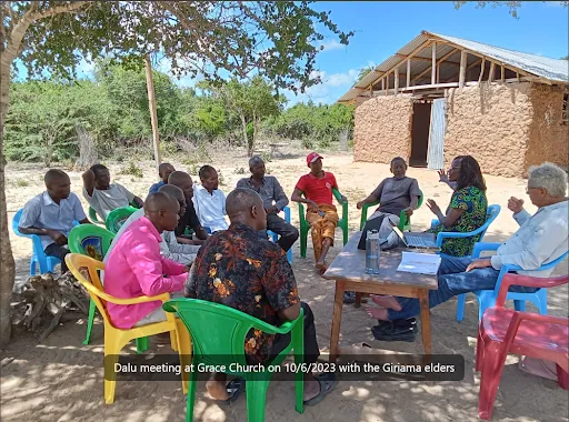 Community elders seated at a meeting